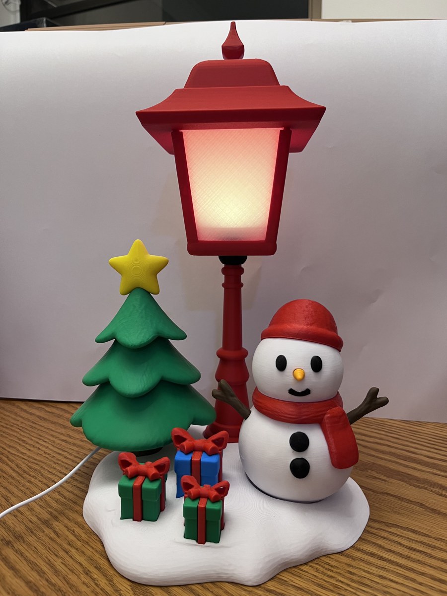 Poste luminoso com boneco de neve